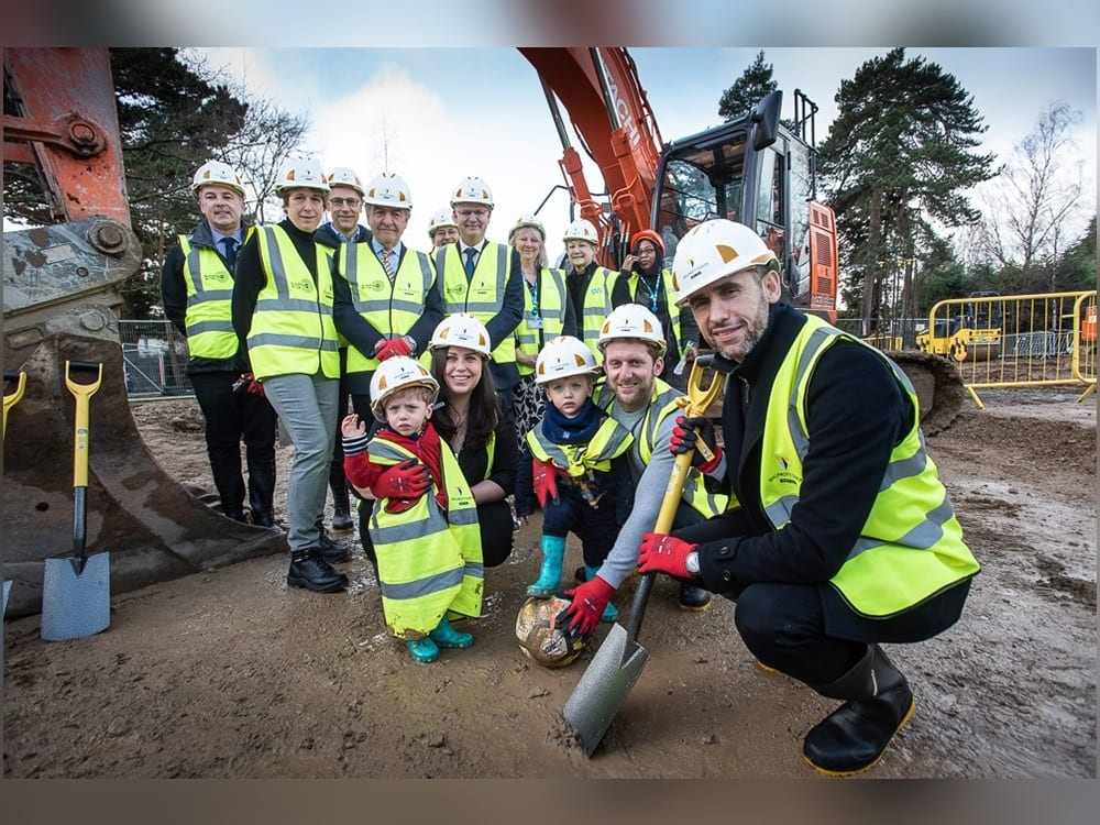 Martin Keown kicks off building with twins, Finley and Billy Kearns, and mum and dad, Laura and Robert
