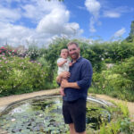 Gardener Dom Ford holding his baby