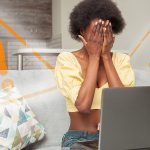Woman hiding from laptop with warning signs around